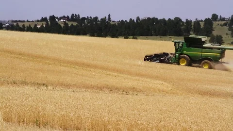 Plowing a field across the frame Stock Footage 78523507