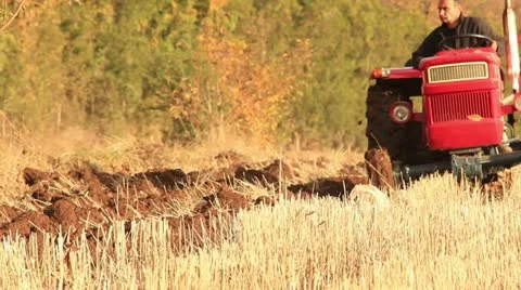 Plowing the field (tractor close up) Stock Footage 12518811