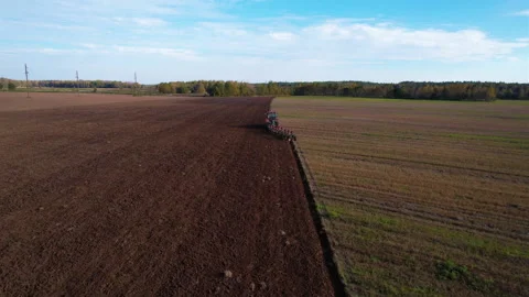 Plowing field with Tractor , drone view. Cultivated and soil tillage. Stock Footage 165594657