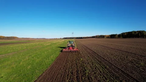 Plowing field with Tractor , drone view. Cultivated and soil tillage. Video stock 167041570