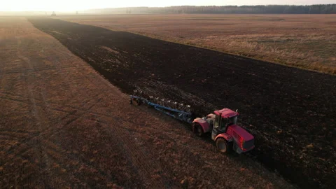 Plowing field with Tractor , drone view. Cultivated and soil tillage. Stock Footage 169141742