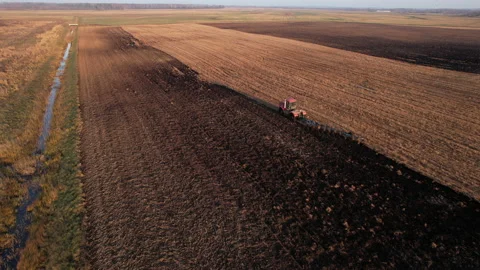 Plowing field with Tractor , drone view. Cultivated and soil tillage. 스톡 동영상 169188211