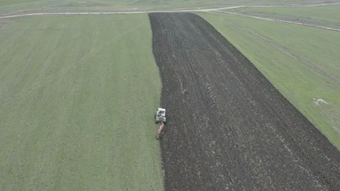 Plowing green field Stock Footage 122283328
