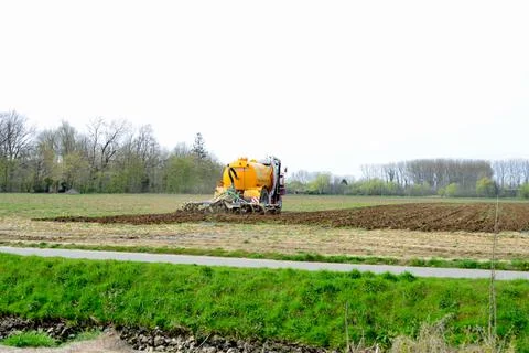 Plowing land by machine in the spring Stock Photos