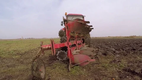 Plowing of paprika field on cloudy fall day. Dolly gimbal video. Stock Footage 84177621