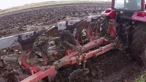 Plowing of paprika field on cloudy fall day. Dolly gimbal video. Stock Footage 84178168