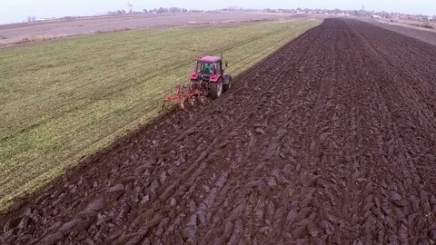 Plowing of paprika field on cloudy fall day. Aerial footage. Stock Footage 84178598