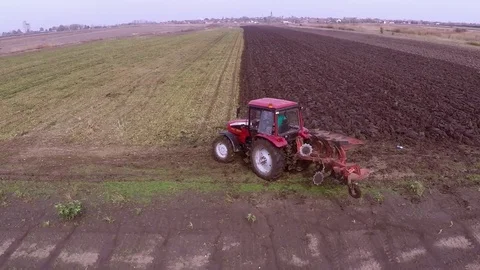 Plowing of paprika field on cloudy fall day. Aerial footage. Stock Footage 84178812