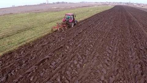 Plowing of paprika field on cloudy fall day. Aerial footage. Stock Footage 84178880