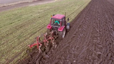 Plowing of paprika field on cloudy fall day. Aerial footage. Stock Footage 84179108