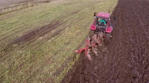 Plowing of paprika field on cloudy fall day. Aerial footage. Stock Footage 84183808