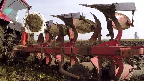 Plowing of paprika field on cloudy fall day. Dolly gimbal video. Stock Footage 84184236