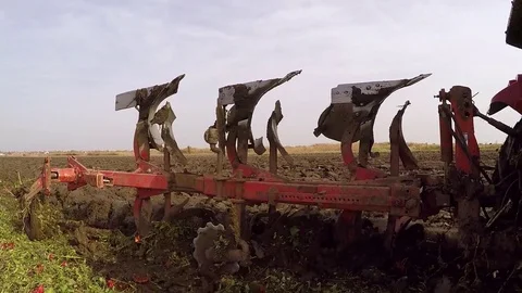 Plowing of paprika field on cloudy fall day. Dolly gimbal video. Stock Footage 84184246