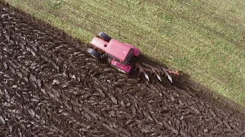 Plowing of paprika field on cloudy fall day. Aerial footage. Stock Footage 84185866