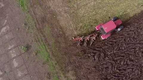 Plowing of paprika field on cloudy fall day. Aerial footage. Stock Footage 84185876