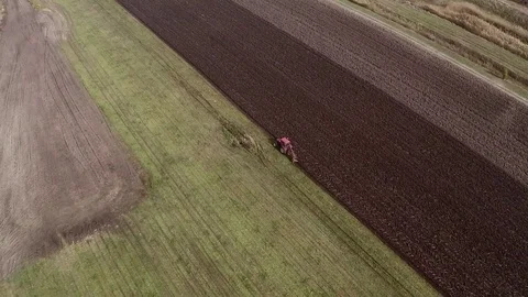Plowing of paprika field on cloudy fall day. Aerial footage. Stock Footage 84186056