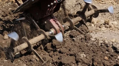Plowing the soil with a motoblock Stock-Footage 76365516