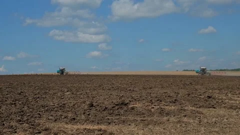 Plowing with a tractor with a plow in the field Video stock 166946536
