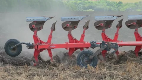Plowing with a tractor with a plow in the field Video stock 166946576