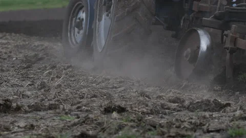 Plows are plowing on the ground to eliminate weeds and prepare crops backgrounds Stock Footage 194377667