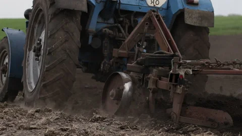 Plows are plowing on the ground to eliminate weeds and prepare crops backgrounds Stock Footage 194377987