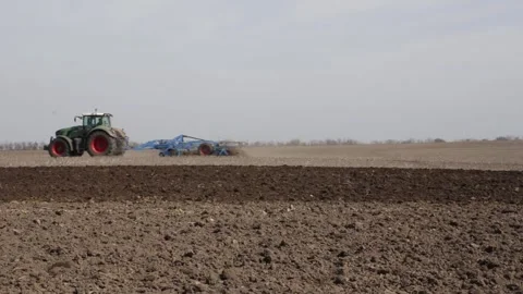 Plows working in the field, cutting through the soil, Stock Footage 302448704