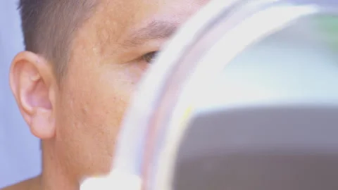 Plucking hair from the ears. 動画素材 338399516