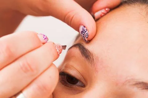 Plucking human brows Stock Photos