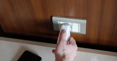 Plug adapter into socket and mobile phone Stock Footage 252812266