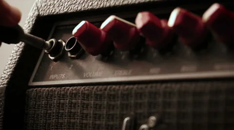 Plug Into Amp and turn up the volume Stock Footage