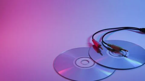 Plug and CD drive . red and blue illumination, cyberpunk. Stock Photos