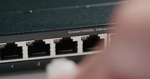 Plug in and out on internet switch 스톡 동영상 137562256