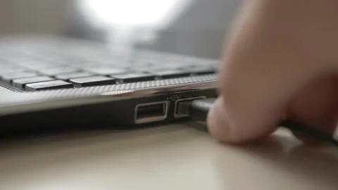 Plug and unplug USB cable from laptop Stock Footage 159994347