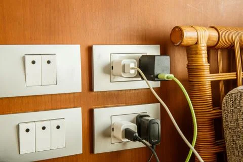 Plug the battery charger. Fotos Stock