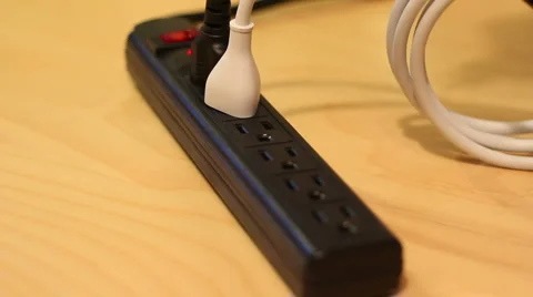 Plug Cables into Power Strip Stock Footage