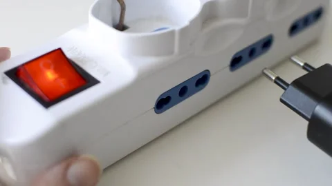 Plug in a charger in a multiple outlet 스톡 동영상 169523534