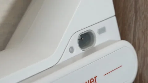 Plug the charger into a power outlet Video stock 115372763
