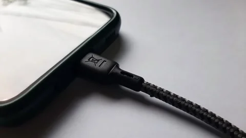 Plug the charging cable from the phone Stock Footage 284442293