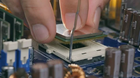 Plug in CPU microprocessor to motherboard socket. Stock Footage 68907079