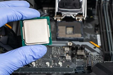 Plug in CPU microprocessor to motherboard socket. Technological background. C 库存照片