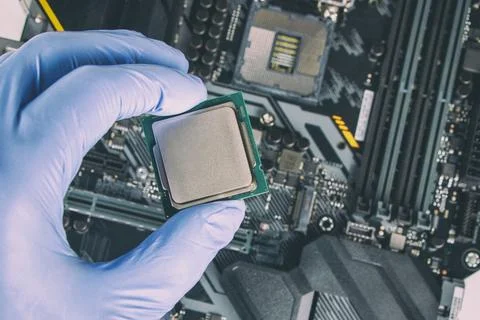 Plug in CPU microprocessor to motherboard socket. Technological background. C 스톡 사진