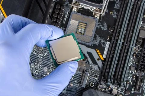Plug in CPU microprocessor to motherboard socket. Technological background. C 库存照片