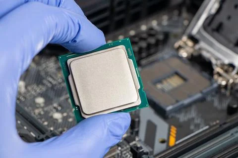 Plug in CPU microprocessor to motherboard socket. Technological background. C 写真素材