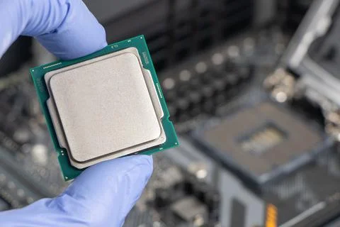 Plug in CPU microprocessor to motherboard socket. Technological background. C Stockfoto's