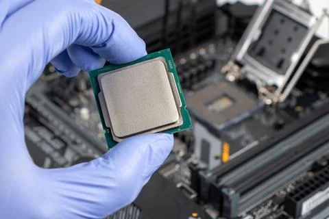 Plug in CPU microprocessor to motherboard socket. Technological background. C 写真素材
