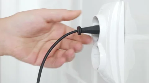 Plug in Electrical Cord in Socket, Plugging Devices, Electric Power View, Save Stock Footage 229383597