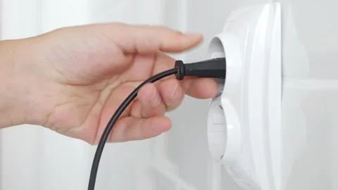 Plug in Electrical Cord in Socket, Plugging Devices, Electric Power View, Save Stock Footage 262032446
