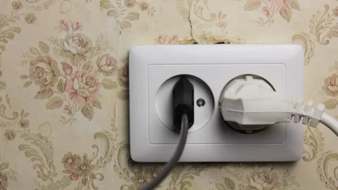 Plug into an electrical socket in the wall close-up.Old electrical socket. Stock Footage 201348000