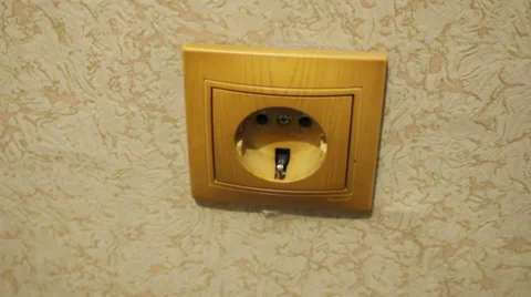 Plug is inserted into the wall outlet Stock Footage 46004130