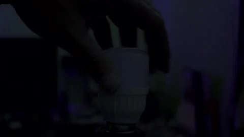 Plug the LED light in the socket Stock Footage 283269914